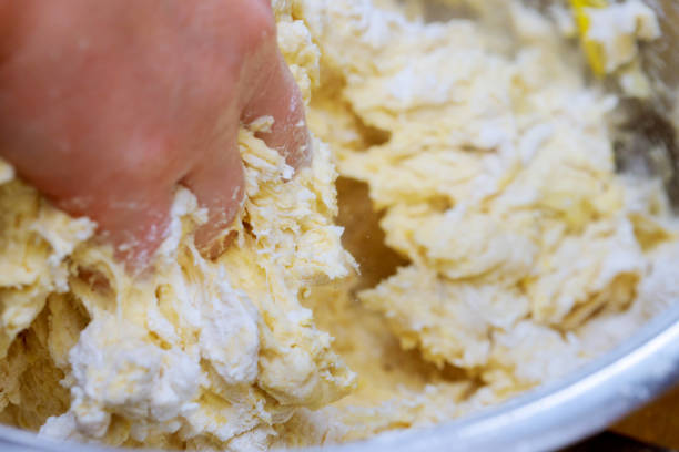 istock Preparing Dough, mixing ingredients. Making Yeast Sweet 905795960