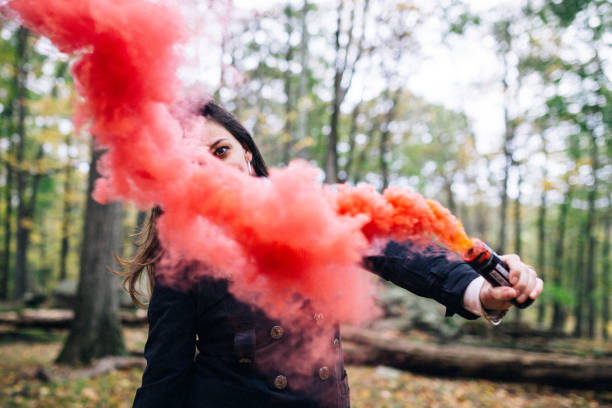 istock Woman with colorful smoke 905798844