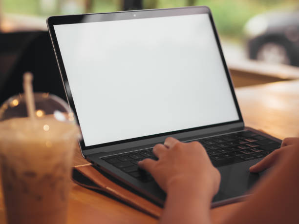 istock Woman is using laptop with a plassic cup of iced coffee. 905799324