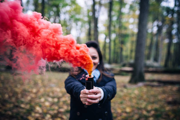 istock Woman with colorful smoke 905799556