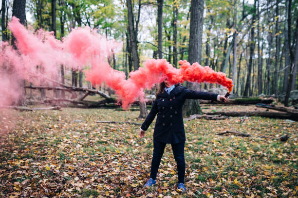 istock Woman with colorful smoke 905799870
