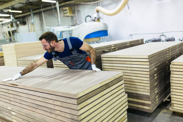 istock Carpenter at work measuring wood plank 905808856