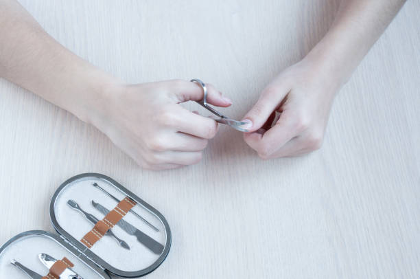 istock The girl at table does her manicure 905815616