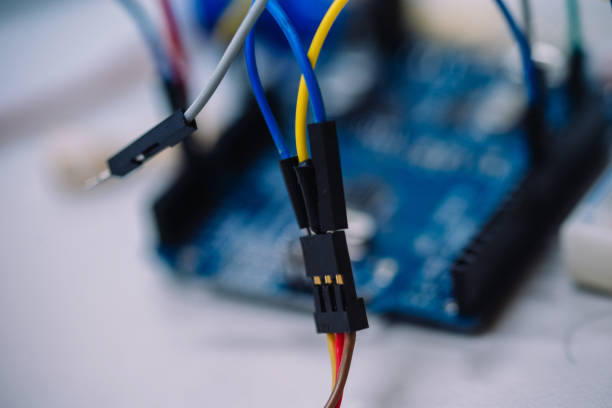 istock Macro photo of a little embedded systems motherboard with attached cables 905818870