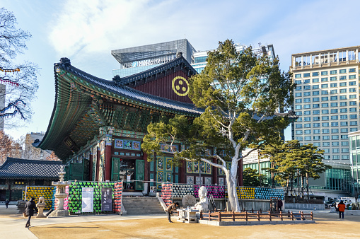 Jogye-sa Shrine in Seoul is the center of Buddhism in South Korea. Photo taken during a cold winter day and contains some tourists visiting the complex.