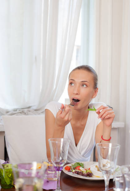 istock Young Female Restaurant Eating 905822760