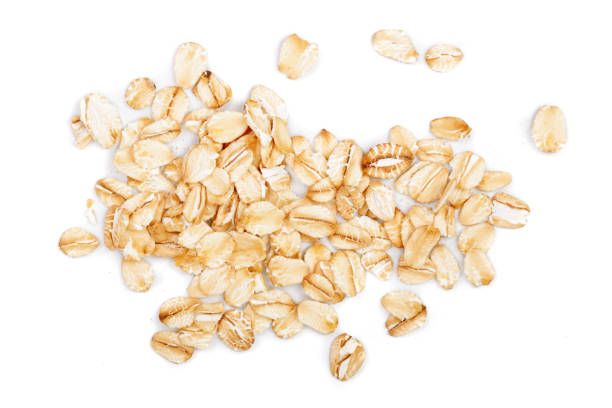 istock oat flakes isolated on white background. Top view 905822908