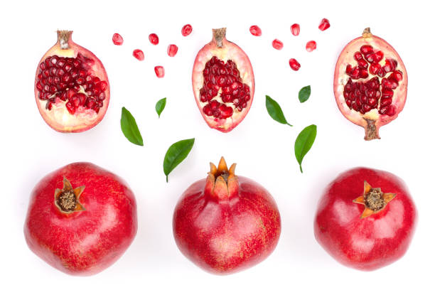 istock pomegranate with leaves isolated on white background. Top view. Flat lay pattern 905823180