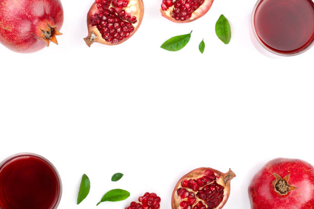 istock pomegranate juice with fresh pomegranate fruits isolated on white background with copy space for your text. Top view 905823626