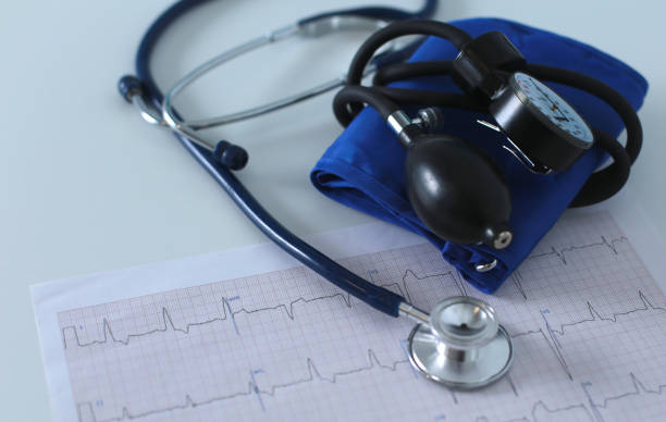 istock docter workplace with a stethoscope Cardiogram chart with medical table closeup,for heart record 905823644