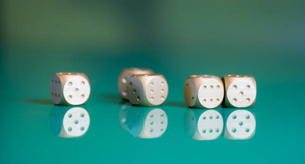 istock playing poker dice on green background 905827946
