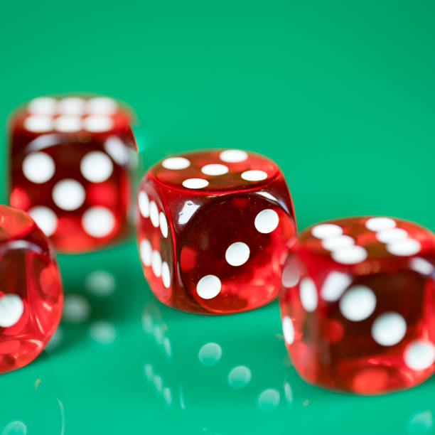 istock playing poker dice on green background 905827984