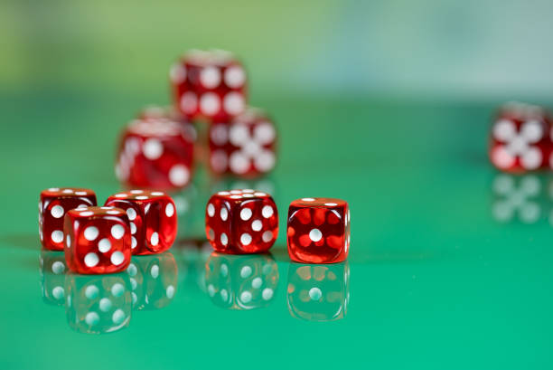 istock playing poker dice on green background 905828048