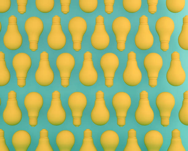 istock Creative idea pattern made of Light bulbs yellow  on green pastel background. Flat lay, minimal concept idea. 905828444