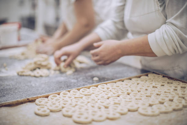 istock Women making pretzels 905831288