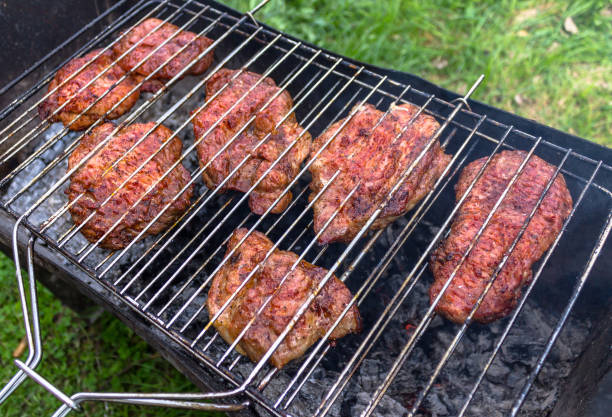 istock Meat cooking, steak on open fire in the open air 905840318