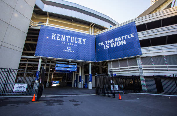 University Of Kentucky Wildcats Football Stadium Lexington, Kentucky, USA - April 22, 2016: Exterior entrance of the University of Kentucky Wildcats football stadium with blue and white banner. ncaa college conference team stock pictures, royalty-free photos & images