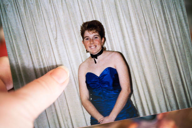 1980s Photo An old photograph of a sixteen year old girl in 1989. Same model in background photos. prom fashion stock pictures, royalty-free photos & images