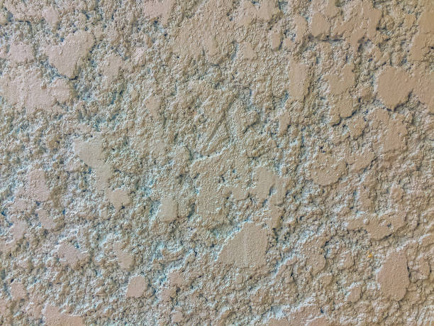 istock Stucco mortar plastered wall texture with grey and rough surface background. 905843644