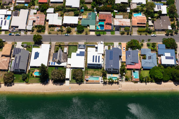 istock Solar panels on suburban waterfront homes 905843938