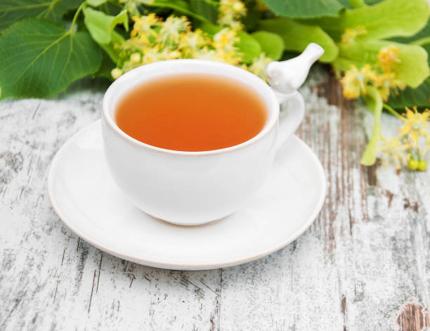istock cup of herbal tea with linden flowers 905845820