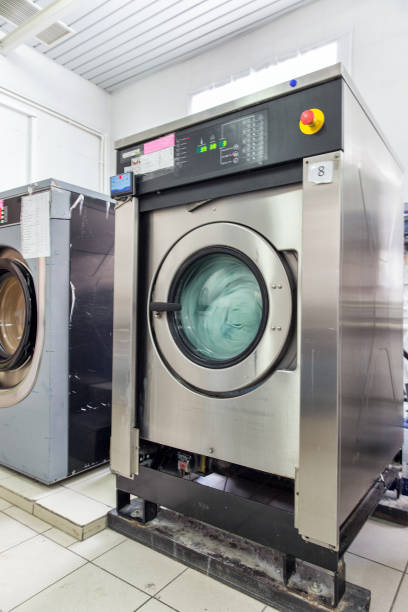 istock Industrial automatic washing machines in laundry 905849156