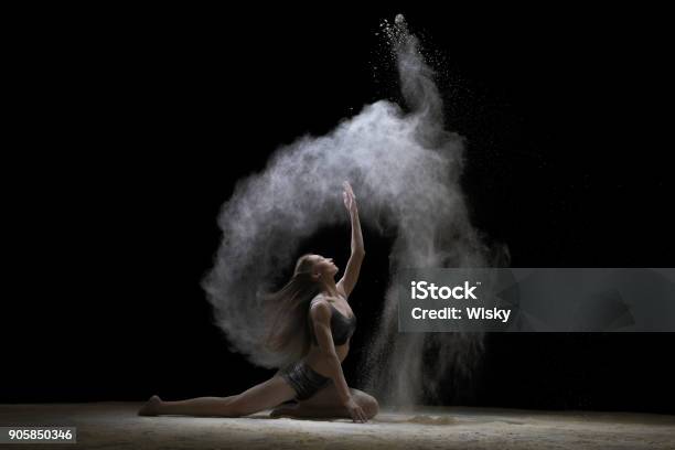 Young Woman Sitting In Fine White Dust Cloud Shot Stock Photo - Download Image Now - Acrobat, Acrobatic Activity, Active Lifestyle