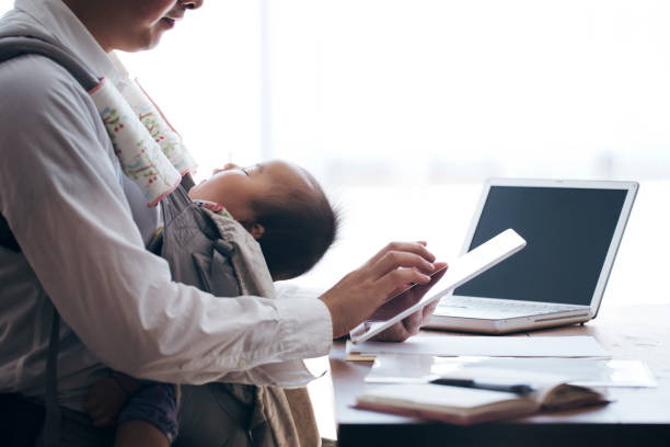 istock Father with baby working at home 905856938