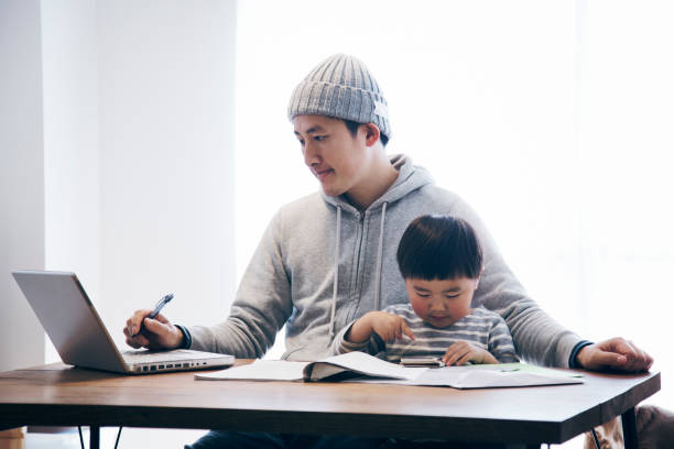 istock Father with son working at home 905857154