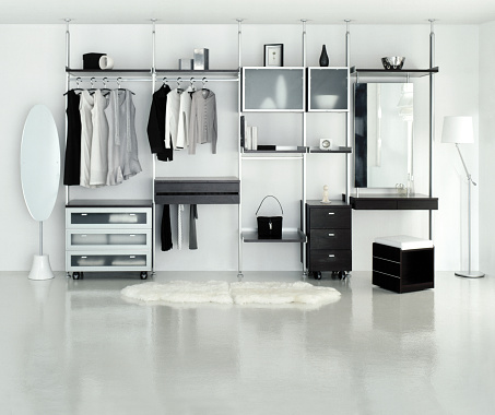 Dressing room with open wardrobe in white color tone.