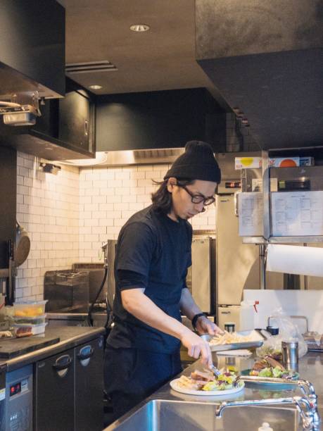 Barista Preparing Food at Cafe Counter