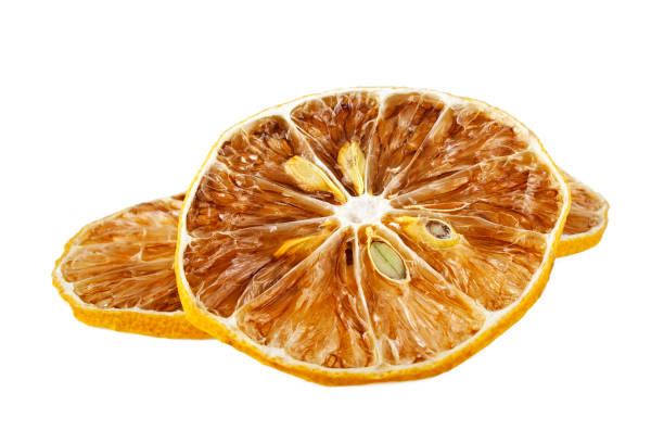 istock Dried lemon slices isolated on white background 905859750