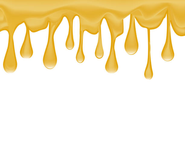 istock Honey splash dripping sweet drops isolated on the white background. 905862406