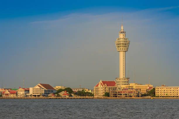 istock Riverfront view of Samut Prakan city hall with new observation tower and boat pier. Samut Prakan is at the mouth of the Chao Phraya River on Gulf of Thailand. 905865340