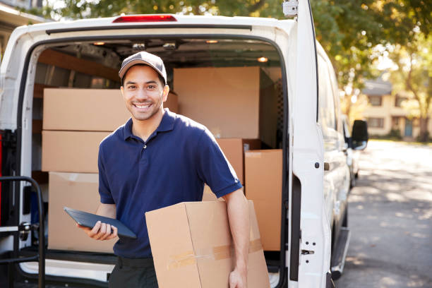 Portrait Of Courier With Digital Tablet Delivering Package Portrait Of Courier With Digital Tablet Delivering Package computer equipment box stock pictures, royalty-free photos & images