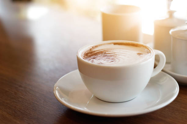 istock Cup of coffee on the wooden table background 905866030