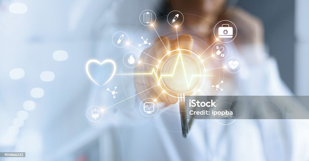 Medicine doctor and stethoscope in hand touching icon medical network connection with modern virtual screen interface, medical technology network concept Healthcare And Medicine Stock Photo