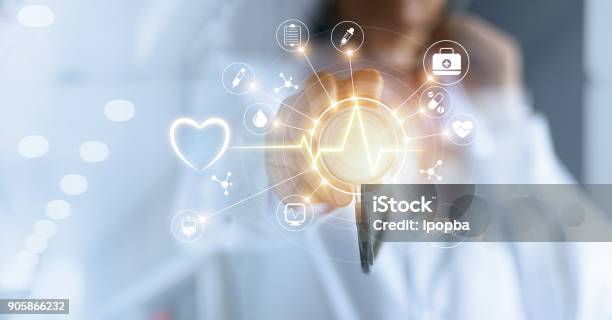 Medicine Doctor And Stethoscope In Hand Touching Icon Medical Network Connection With Modern Virtual Screen Interface Medical Technology Network Concept Stock Photo - Download Image Now