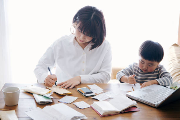 istock Mother with son working at home 905869532