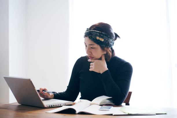 istock Woman working at home 905869648