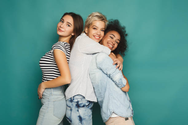 istock Happy friends having fun at blue background 905874444