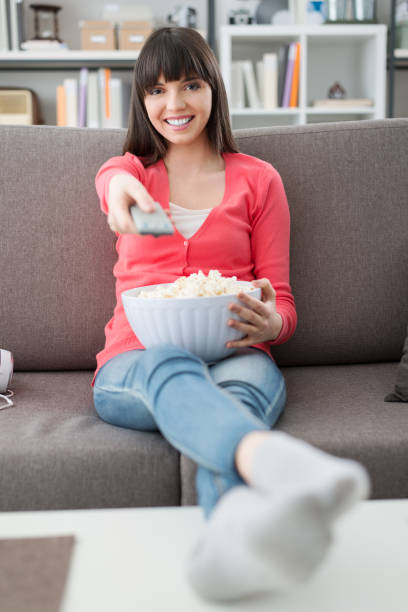 istock Woman watching tv 905874800
