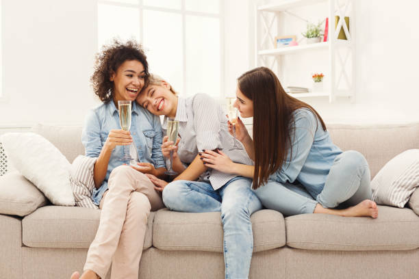 istock Friends chatting with wineglasses at home 905874962