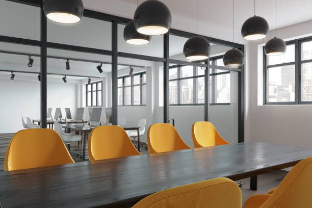 istock Wooden table, yellow chairs meeting room side 905875598