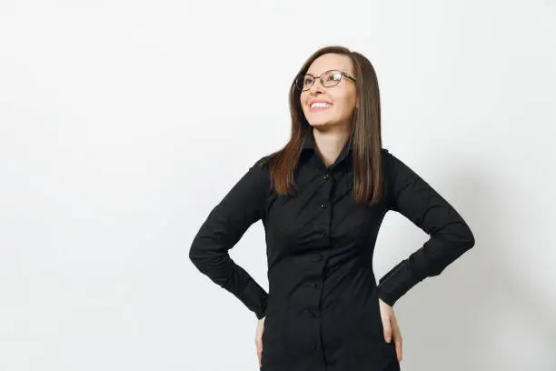 Beautiful happy caucasian young smiling brown-hair business woman in black classic shirt, skirt, glasses isolated on white background close up. Manager, worker, student. Copy space for advertisement