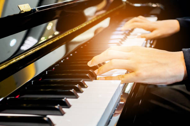 istock Close up musician hand playing piano 905878350
