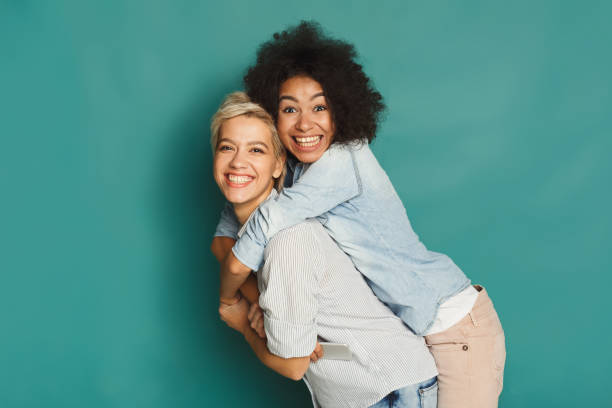 istock Happy friends having fun at blue background 905879134