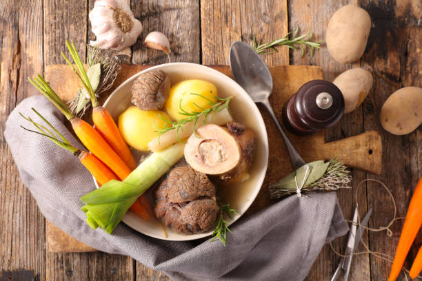 pot au feu, beef with broth and vegetable pot au feu, beef with broth and vegetable boiled stock pictures, royalty-free photos & images
