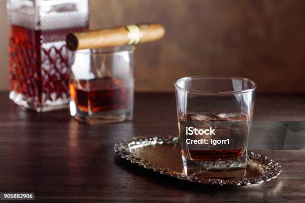 Glass Of Whiskey And Cigar On Old Wooden Table Stock Photo - Download Image Now - Alcohol - Drink, Amber, Backgrounds