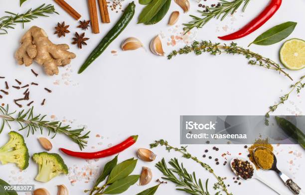 Selection Of Spices Herbs And Greens Ingredients For Cooking White Background Top View Copy Space Stock Photo - Download Image Now